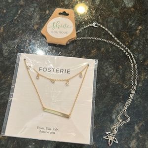 Two necklaces: Gold Fosterie necklace frm Causebox. Silver flower charm necklace